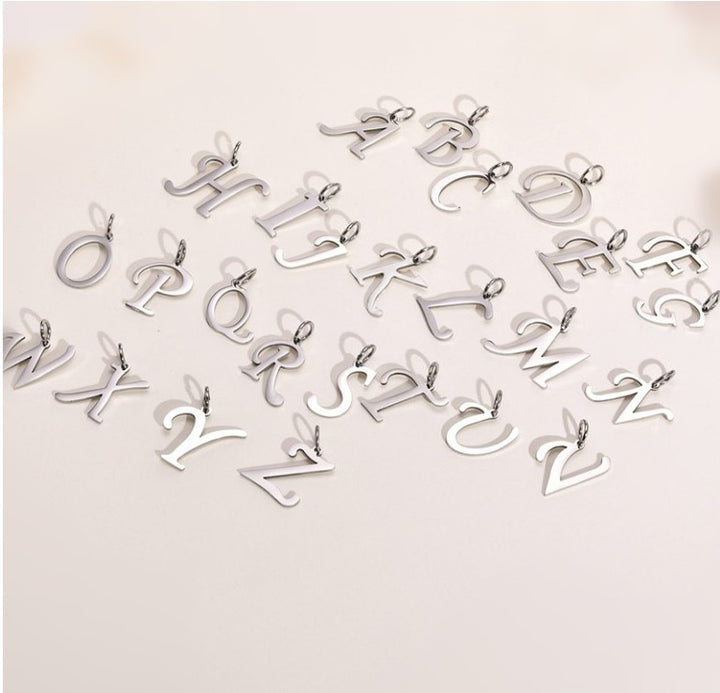 Kirurginteräs Kirjainkaulakoru