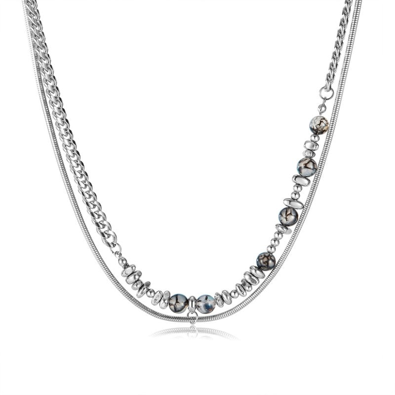 Kaksikerroksinen Teräskaulakoru